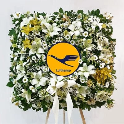 Corona de condolencias cuadrada en atril con logo